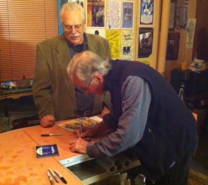 Geoff Muldaur autographs a CD for a fan